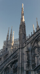 Fototapeta na wymiar Towers of the Duomo Cathedral in Milan