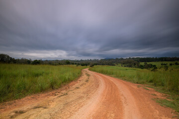 View of dirt road in countryside