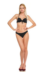 Young blond woman posing in swimsuit