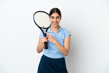 Handsome young tennis player caucasian woman isolated on white background pointing to the side to present a product