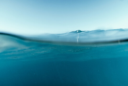 Split View Half Over and Under Ocean Surface whit Clear Sky. Background Concept