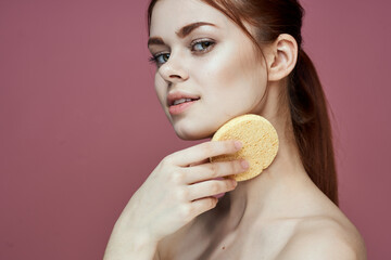 woman with bare shoulders sponge in hands clean skin hygiene