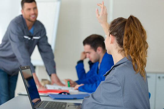 portrait of female mechanic in classroom