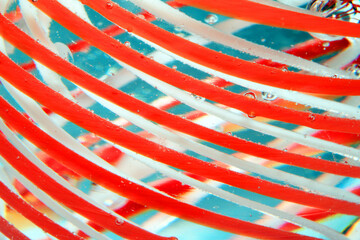 Vibrant Abstract Glass Swirls and Bubbles from a Paperweight with Lines and Colours