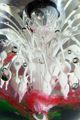 Vibrant Abstract Glass Swirls and Bubbles from a Paperweight with Lines and Colours