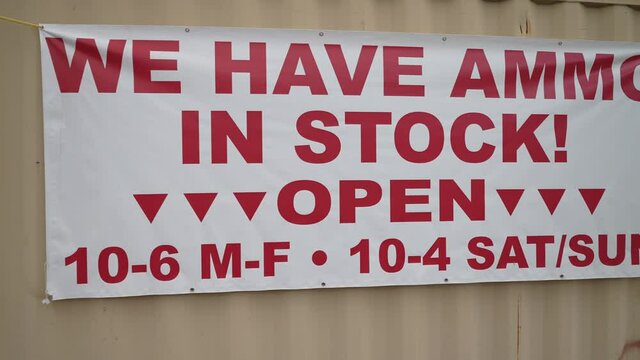 Sign on rural road advertising ammo in stock.