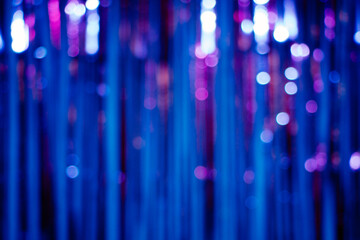 Abstract background of a blurred blue glitter curtain