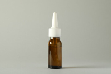 Bottle of nasal spray on light grey background
