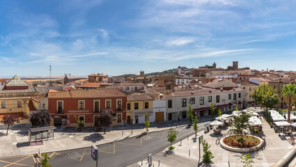 Fototapeta na wymiar Panoramic view at the Cáceres city downtown, Torre Bujaco, Arco de la Estrella and other heritage buildings