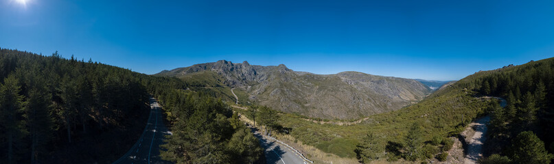 Fototapeta na wymiar Panoramic aerial view at the top of the mountains of the Serra da Estrela natural park, Star Mountain Range, glacier valley and mountain landscape