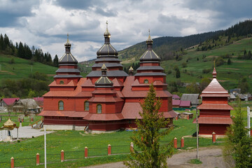 Red church in The Volosianka village in Carpathian Mountains, Ukraine