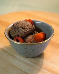 Chocolate icecream with raspberries