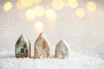 Ceramic figurines of houses in the snow.