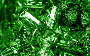 Green crystal mineral stone. Gems. Mineral crystals in the natural environment. Texture of precious...