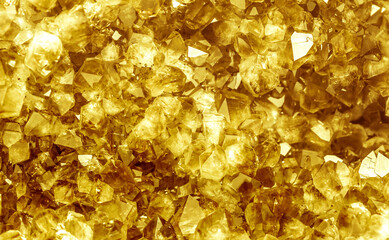 Golden crystal mineral stone. Gems. Mineral crystals in the natural environment. Texture of precious and semiprecious stones. Seamless background with copy space.