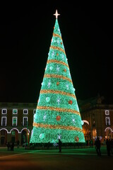 Wonderfully illuminated giant Christmas tree at night, Commercial square, Praça do Comércio,...