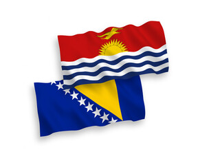 National vector fabric wave flags of Republic of Kiribati and Bosnia and Herzegovina isolated on white background. 1 to 2 proportion.