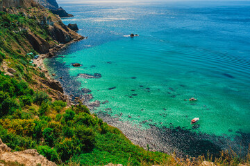 Panoramic sea view on Cape Fiolent in Crimea. A famous place for tourists on the Black Sea coast with azure water