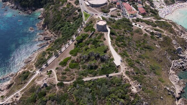 Amazing aerial shot of Spanish tower Rena Bianca, Sardinia, taken on summer day Italy Santa Teresa Gallura.