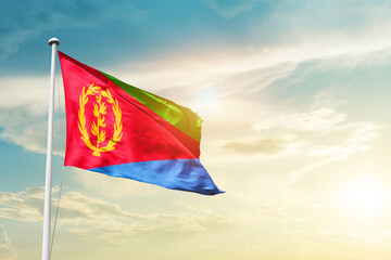 Eritrea national flag cloth fabric waving on the sky - Image