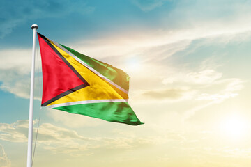 Guyana national flag cloth fabric waving on the sky - Image