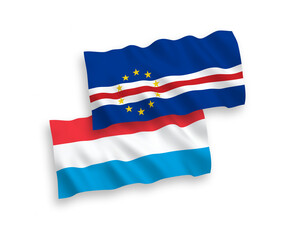 National vector fabric wave flags of Republic of Cabo Verde and Luxembourg isolated on white background. 1 to 2 proportion.