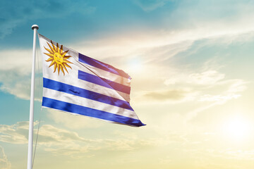 Uruguay national flag cloth fabric waving on the sky - Image