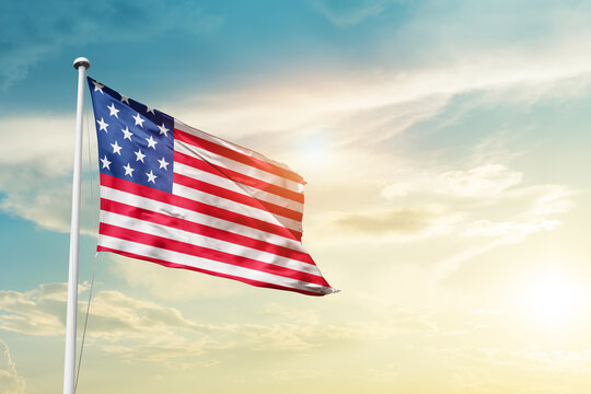 United States national flag cloth fabric waving on the sky - Image