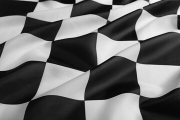 Checkered finish flag as background, closeup view