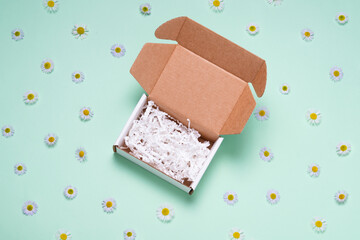White cardboads box on color background empty inside, top view