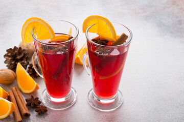 Mugs of mulled wine. Ingredients for a cocktail. Hot winter drinks based on sparkling wine.