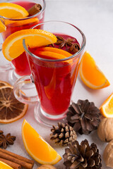Mugs of mulled wine. Ingredients for a cocktail. Hot winter drinks based on sparkling wine.