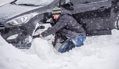 Winter, people and car problem concept. Man stuck in the snow. Mutual aid. Winter problem....