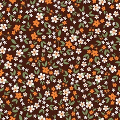 Seamless vintage pattern. brown background. small white and orange flowers. green leaves. vector texture . trend print for textiles and wallpaper.