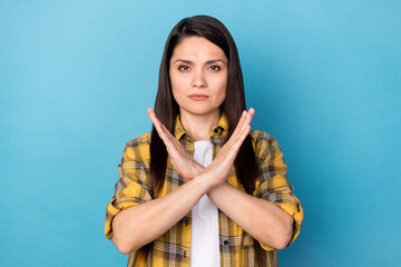 Photo of mature woman serious crossed hands refuse prohibition decline isolated over blue color...