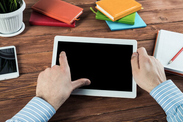 businessman with a tablet, works in the office