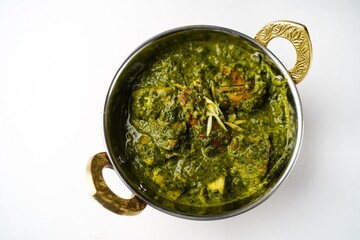 Homemade Palak chicken isolated on white