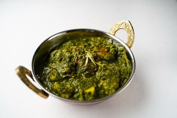 Homemade Palak chicken isolated on white