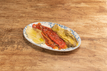 Plate of typical escalivada from the Catalan region on light wooden table