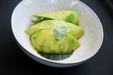 Avocado appetizer with edamame beans and green sauce