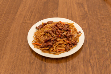 Chow mein is the Chinese version of Japanese yakisoba, a fried noodle dish that is usually accompanied by vegetables and meat