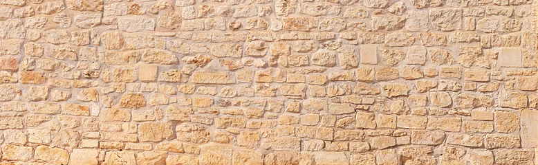 Foto auf Leinwand natural wide panorama wall design pattern background  rustic rough warm sand stone texture © stockphoto-graf