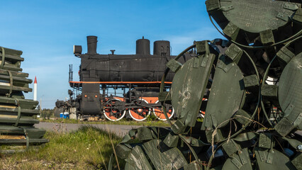 Retro Soviet steam locomotive. Veteran railways. Vintage black steam locomotive train rush railway.