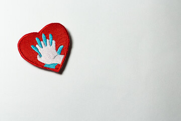 Heart shaped badge with CPR icon isolated on a white background with free space for tex, on the left.