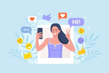 Social media influencer at work. Woman with phone taking picture of herself to be posted online. Social media marketing or network promotion, SMM for actively promote the blog on social networks.