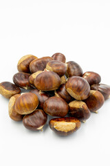 Organic chestnuts on a white background with shadow. close up