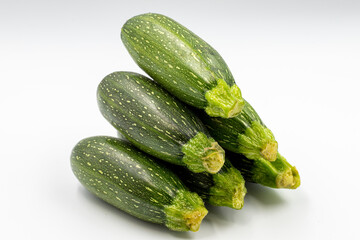 Fresh zucchini on white background with shadow. Close up