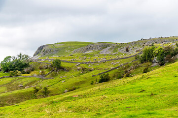 A view of an escarpment on the slopes on Ingleborough, Yorkshire, UK in summertime