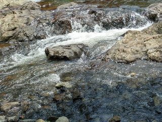 Cascade over and around rocks