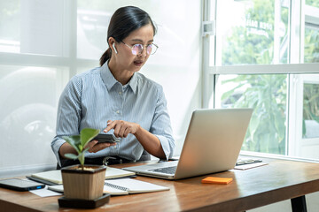 Business woman talking a video conference with partner about financial planning and press on...